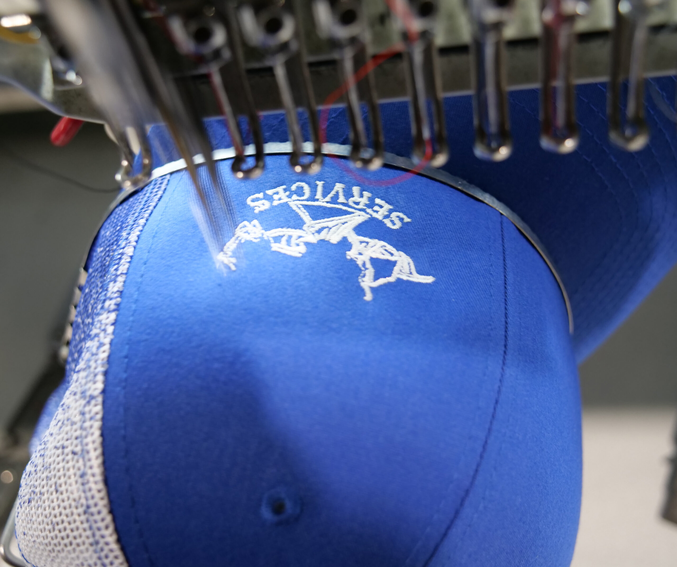 Embroidery machine running caps